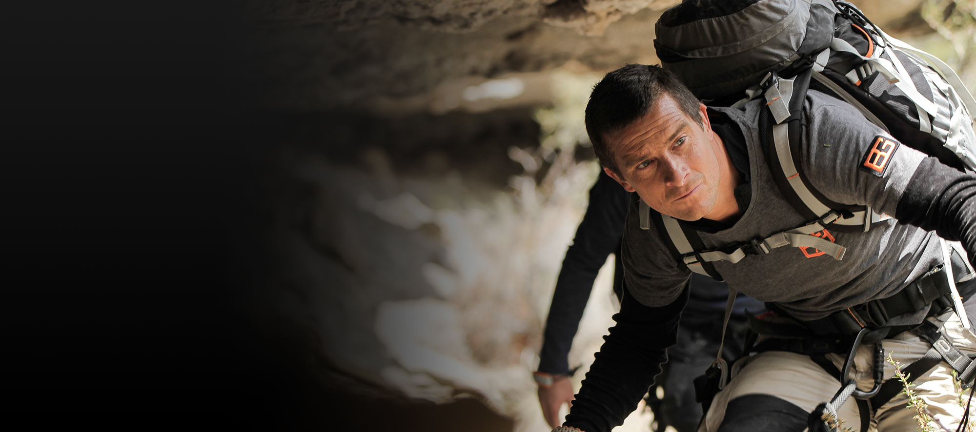 Bear Grylls exploring a cave