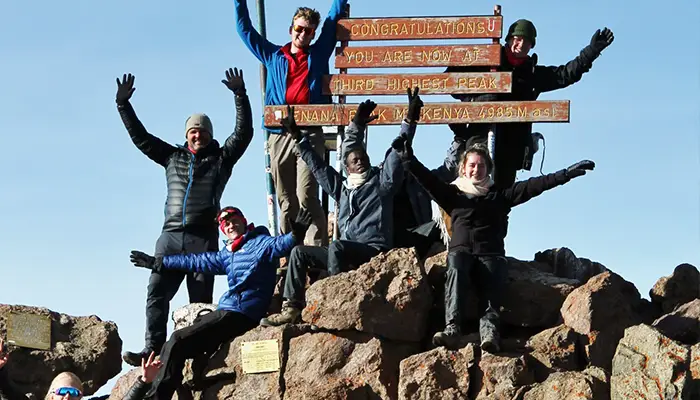 BecomingX expedition students celebrate reaching the summit of Mount Kenya
